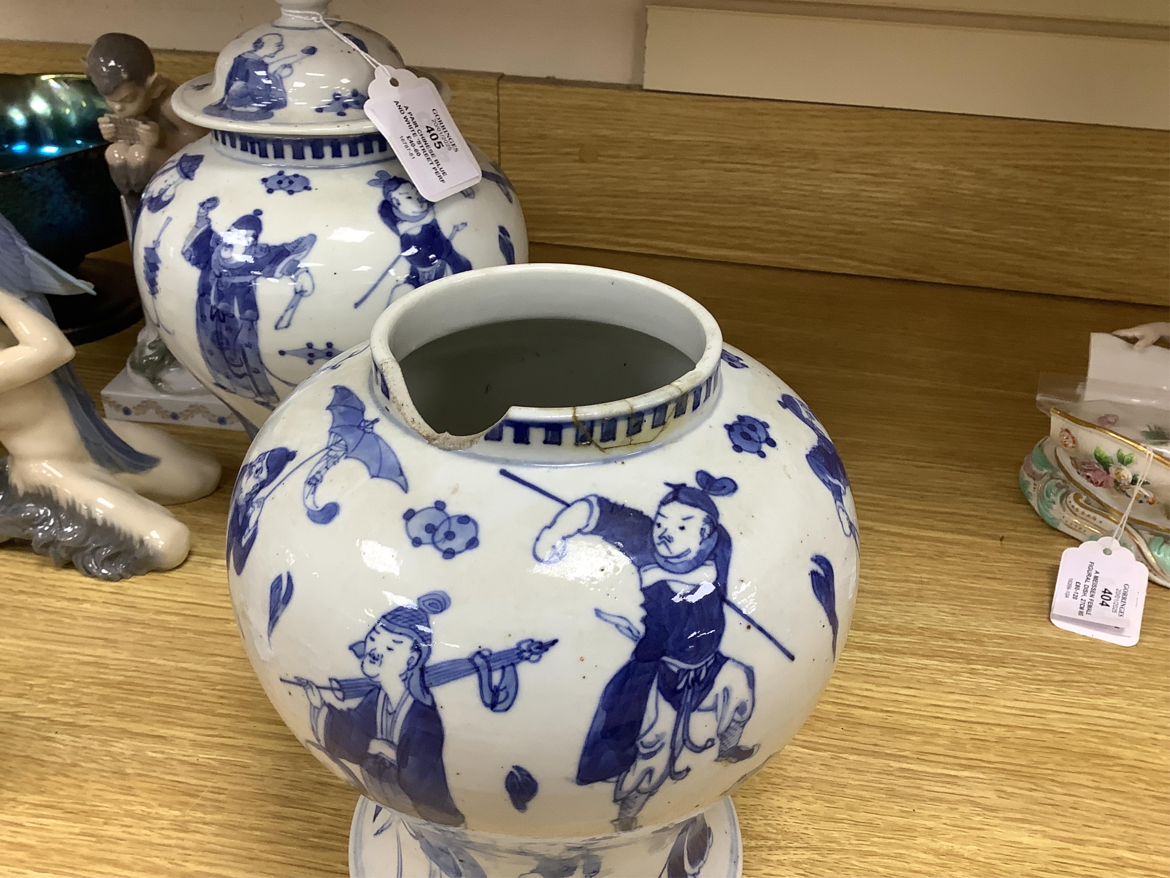 A pair of Chinese blue and white ‘street performers’ baluster vases, circa 1900, 25cm. 25.5cm. Condition - damaged